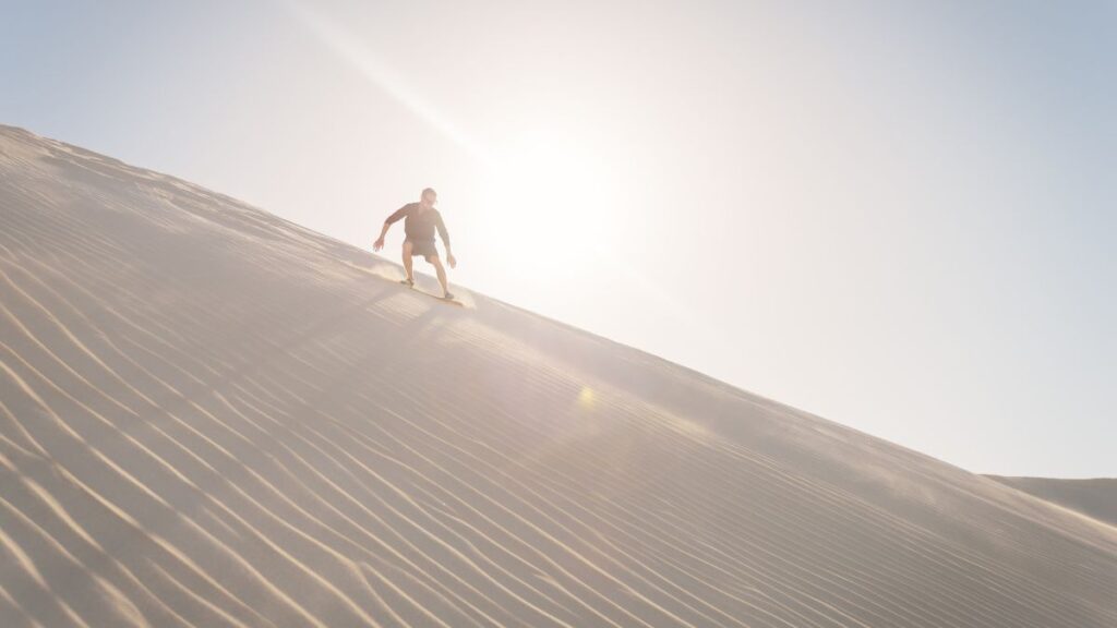 Dune surfing in Namibia should be on your list for emerging tourist destination activities